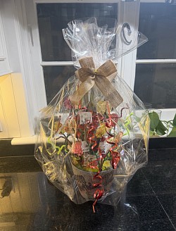 Large baskets start at $40 (12 lollies and at least one specialty lollie in custom shapes and colors to match your theme)  The zombie theme basket shown was $50 and included 12 1oz in three different flavors and zombie themed shapes as well as two 14 oz specialty lollies and 8 oz of hard candy.